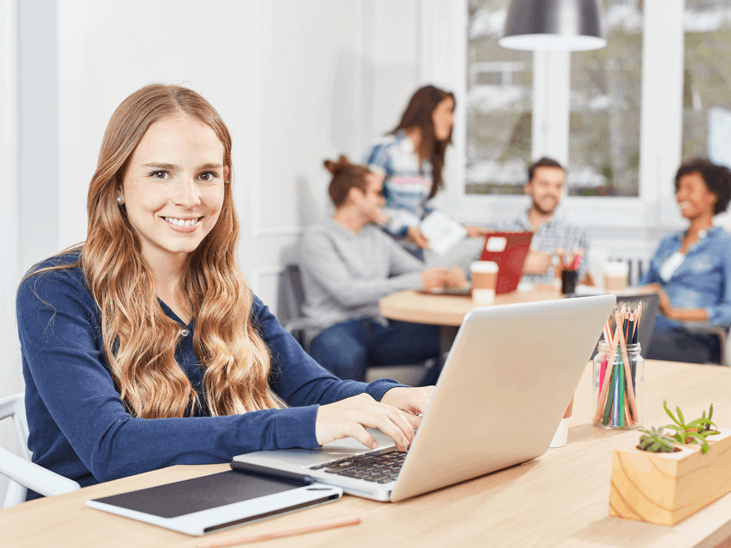 Girl working at a computer in an office