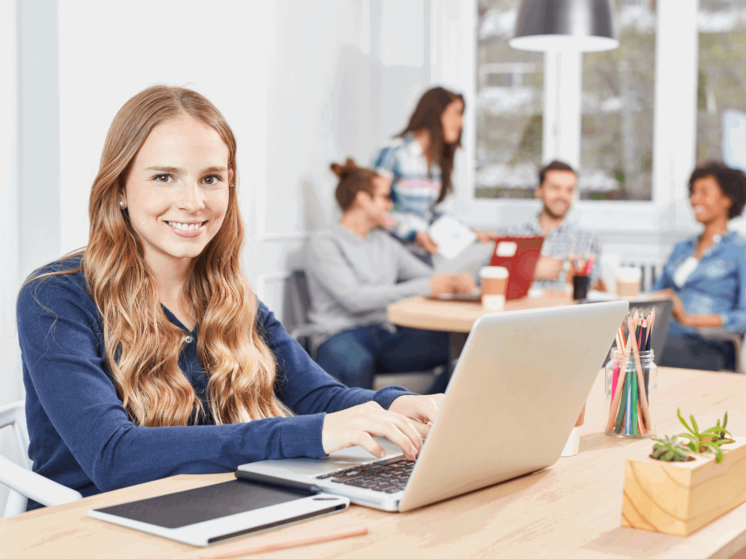 Girl working at a computer in an office